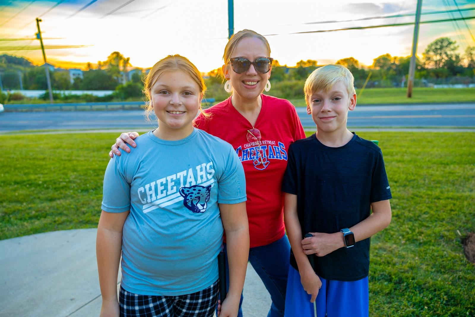 principal and two students at mini golf